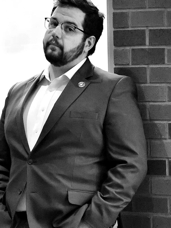 David Reilly — Backlash Podcast Host · Idaho Tribune Operator · Former IFF Communications Contractor — Idaho Extremism dossier portrait